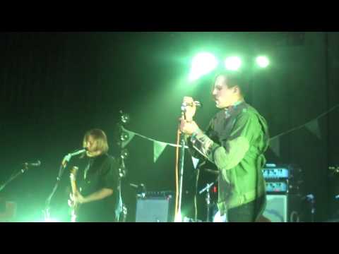 Arcade Fire’s Win Butler Punches (?) Photographer